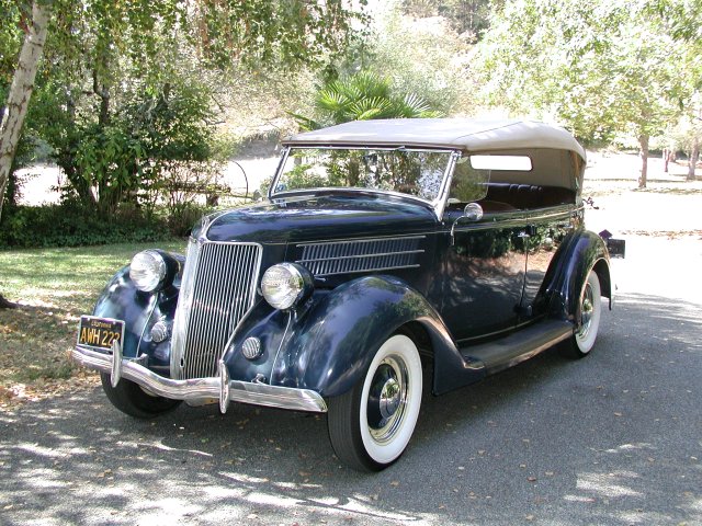  that classy ride in the photo is a 1936 Ford Phaeton